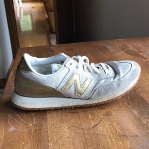 Gold new balance sneakers